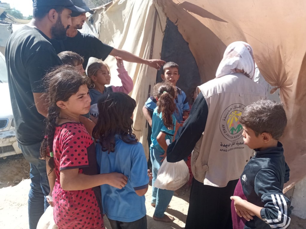 Distribuzione pane a Deir al-Balah, 24/12/24